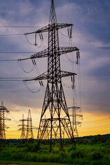 Electric tower in the evening sky. Power transmission facilities.