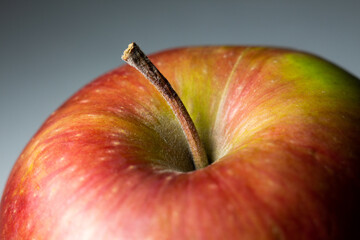 ripe apple close-up on a gray background