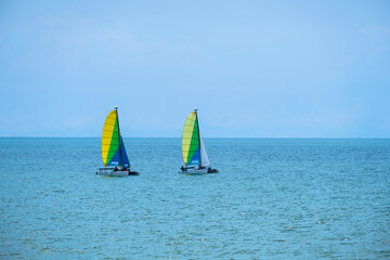 Two sailboats on peaceful  in waters