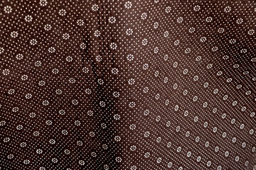 Floral round fabric pattern with dots brown color, nice pattern background 