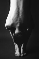 Details of body black and white portrait of man, fashion and art studio portrait of man

