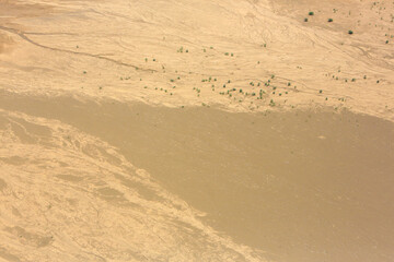 Aerial view of a flock of lesser flamingos over Lake Little Magadi in the Great Rift Valley. Little Magadi is part of Lake Magadi, the southernmost lake in the Kenyan Rift Valley, north of Tanzania.