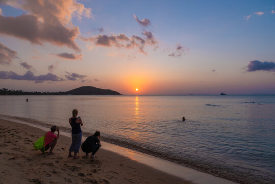 people relax and take pictures of sunset on Lipa Noi beach on Koh Samui in Thailand, travel and paradise enjoyment