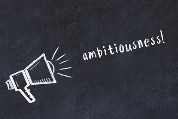 Chalk scetch of loudspeaker and inscription ambitiousness