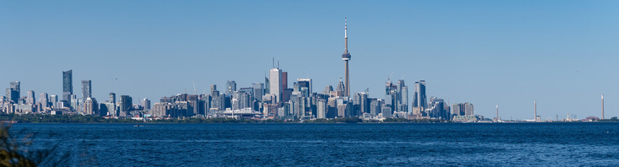 Fototapeta premium A panoramic view of Toronto, Ontario, Canada, and Lake Ontario, on a summer day with blue and clear sky 