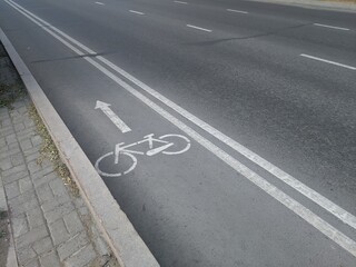 sign on the asphalt bike path