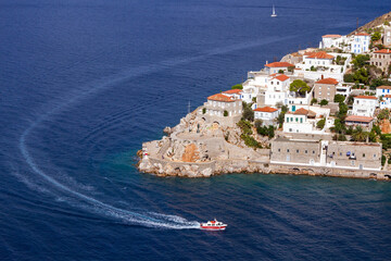A sea taxi is just entering the port of Hydra island, in Argosaronic Gulf, near Athens, Greece.