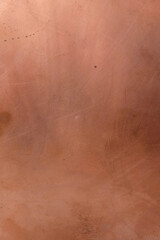 Copper surface. Scratched copper plate in daylight in Ukraine. Copy space. Minimalism. Vertical image.