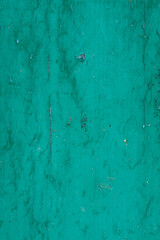 green painted board. wooden background