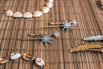 Fototapeta premium Pearl, Seashell, Beads Accessories on Natural Bamboo Background