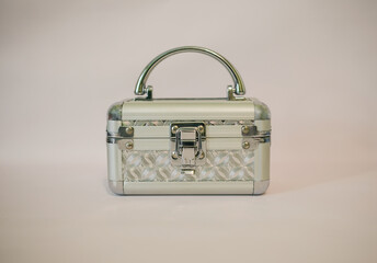 A beautiful silver chest for cosmetics and jewelry on a light background.