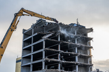Building House destruction Demolition site Excavator with hydraulic crusher machine ruin house