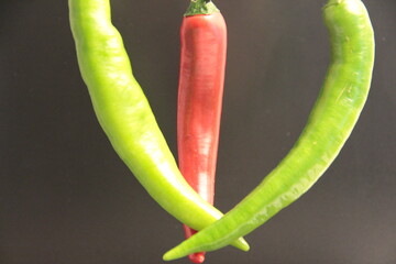 fresh organic peppers on a black background