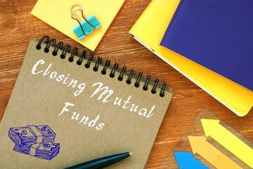 Closing Mutual Funds sign on the sheet.