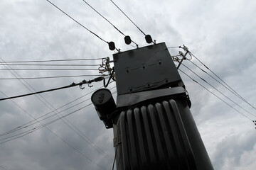 Old transformer on a background of cloudy sky