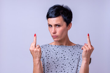 Attractive woman making a middle finger gesture