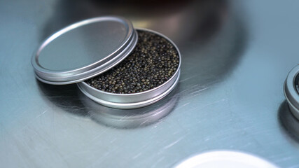 Quality black caviar with sturgeon. Workshop for the production of a quality product. Beluga and trout in the food industry. Stock photo
