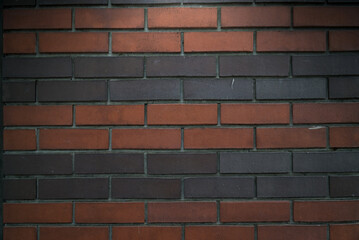 Abstract old brick wallpaper background, old texture background of red stone and dark grey blocks closeup.