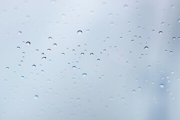 Rainy season. Rain drop on the glass of the window.
