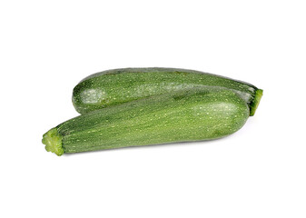 whole unpeeled fresh zucchini on white background