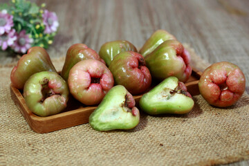 Rose apple fruit in wooden tray