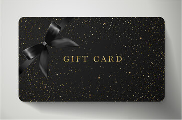 Sparkle gold stars on black gift card.  Template with twinkling elements and bow (ribbon) useful for any design, shopping card (loyalty card), voucher or gift coupon