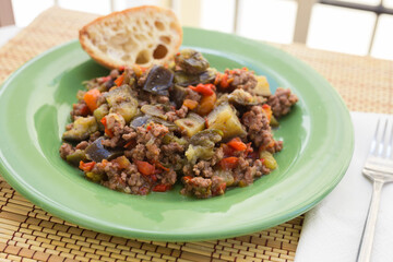 dish of vegetable stew. stewed eggplant, minced meat, carrots, peppers, onion squid