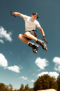 Aggressive inline skating. Young athlete performs tricks during freestyle rolling.