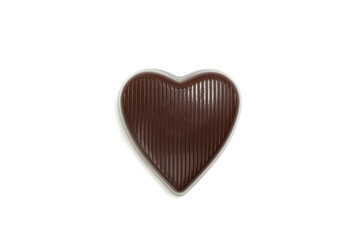 Tasty chocolate candy in the heart form isolated on white background