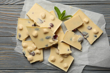 Baking paper with white chocolate and mint on gray wooden table