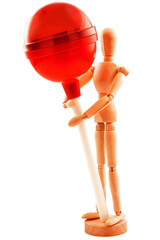 Concept with lollipop, candy and wooden toy. Isolated on white background.
