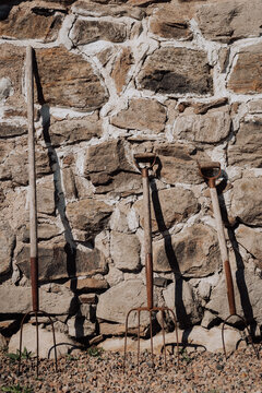 Old toold by a stonewall