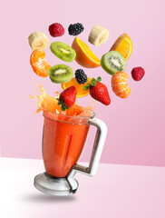 Smoothie mixer with drink and fruit flying ingredients, isolated on pink background