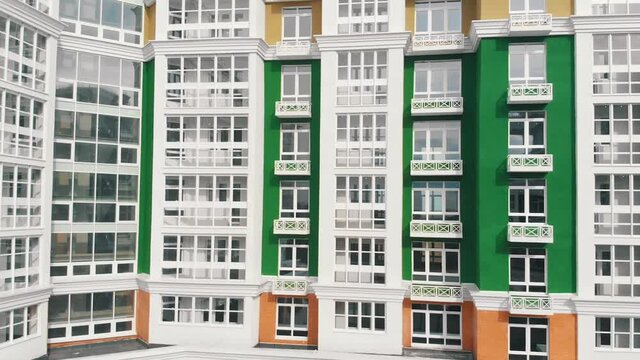 renovated multi-storey building of green white colors aerial