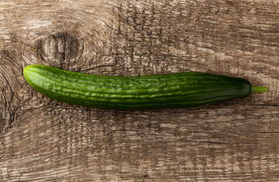 Cucumber On Wooden Background