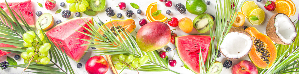 Assorted different summer tropical fresh raw fruits and berries. Clean eating, healthy lifestyle, diet and vitamin concept. 