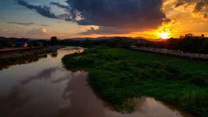 Obraz premium The aerial view of river deltas or sand bar with the background dramatic sunset.