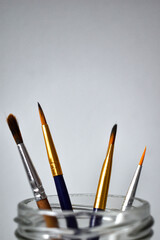 different paint brushes with a white background
