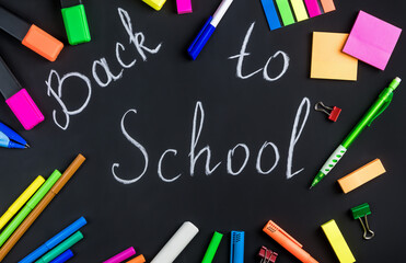 Back to school is written in white chalk