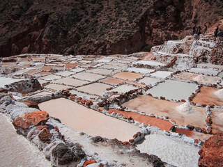 Salt mines built on stones in the sacred valley of the Incas, Peru.