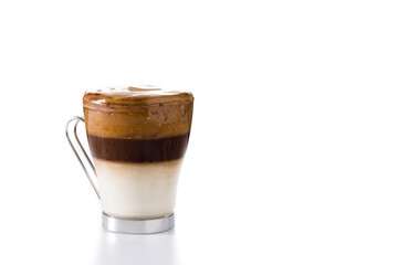 Creamy iced dalgona coffee in glass isolated on white background. Copy space
