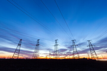 Fototapeta premium In the evening, the high voltage tower and the beautiful sunset glow