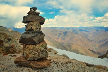 pieces of stones balancing over another as a symbol of peace of mind and balance.