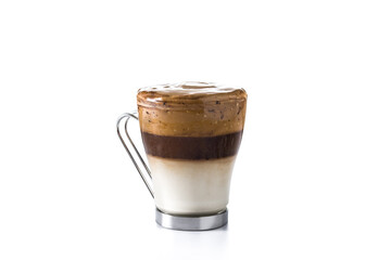 Creamy iced dalgona coffee in glass isolated on white background