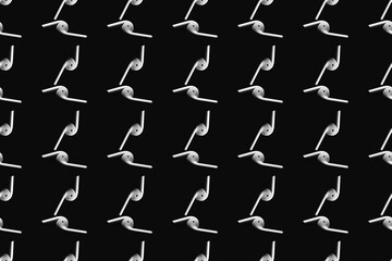 Pattern with white wireless headphones on a black background. Technology minimalism