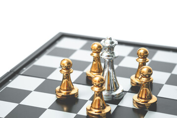 Queen chess been surrounded by enemies. Business strategy concept.