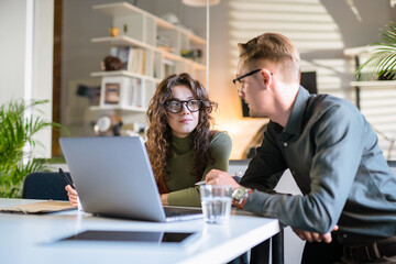 In Creative Office Productive Coworkers Standing at the Table, Company Meeting. Businessman And...