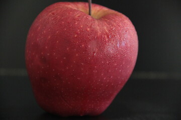 fresh and organic apples on a black background