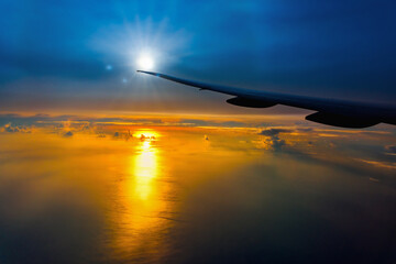 Fototapeta na wymiar wing and cloud floating on sky on sunset.