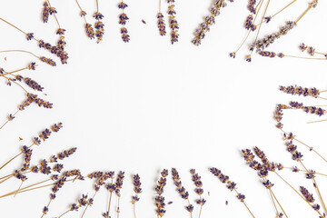 Frame of dry flowers lavender on a white background. Autumn concept. Beautiful background. Copy space, border.